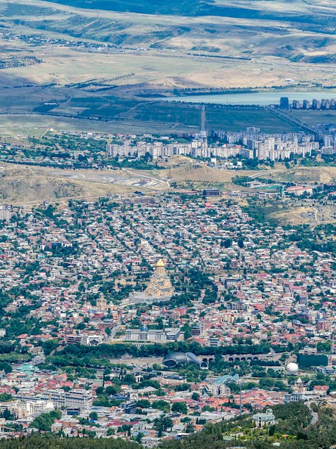 Aerial view of urban landscape representing city-wide financial reach
