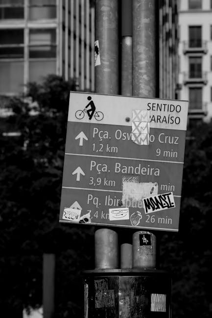 Black and white street signs showing direction